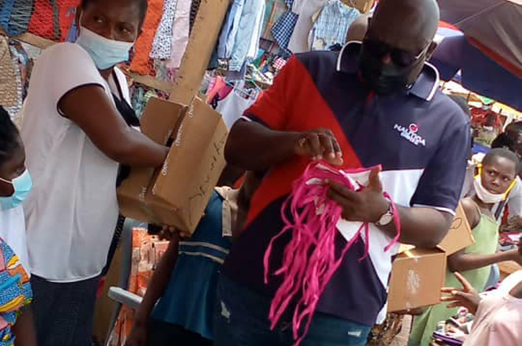 Shai-Osudoku DCE Donates Facemask, Sanitizers to Asutuare Market Women.