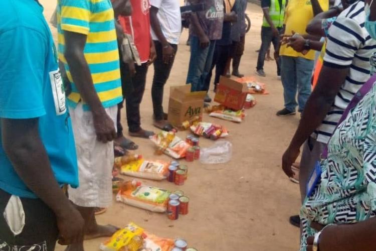 DISTRIBUTION OF FOOD (RELIEF ITEMS) TO THE EVACUATED VICTIMS IN THE SHAI-OSUDOKU DISTRICT.