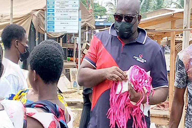 Shai-Osudoku DCE Donates Facemask, Sanitizers to Asutuare Market Women.